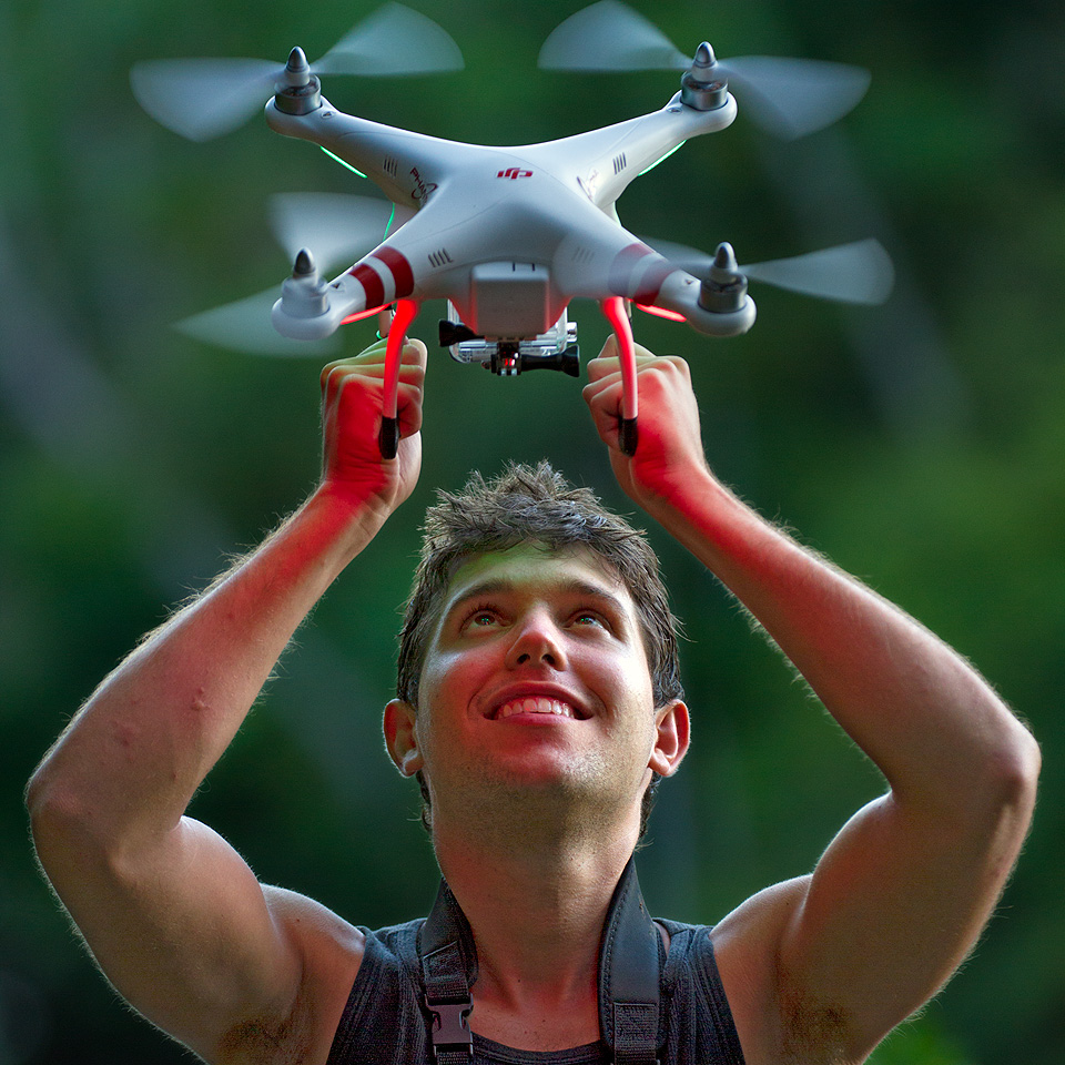 Alejandro Arteaga holding a drone in Tiputini, Ecuador